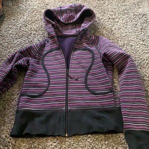 Purple and black striped lululemon zip up sweater.